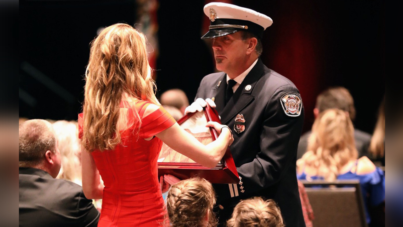 Caylie Valenta Accepting Folded Flag in Honor of her husband